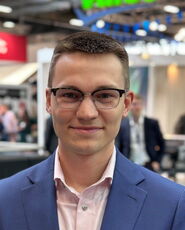 A person poses for a headshot.