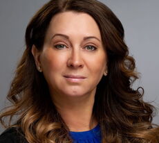 A person poses for a headshot.