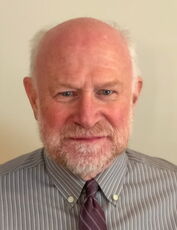 A person poses for a headshot.