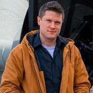 A person poses for a headshot.