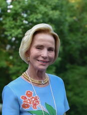 A person poses for a headshot.