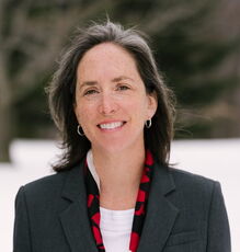 A person poses for a headshot.