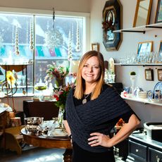 Barbara Konsin in her home decor store, in front of the window