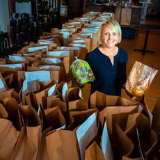 Krista Cole with bags of prepared food