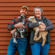 Karl Schatz and Margaret Hathaway with baby goats.