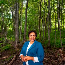 Krystal Williams by a tree