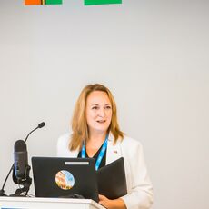 Dana Eidsness at a podium.