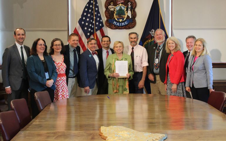 Maine Governor Janet Mills with lawmakers in Augusta