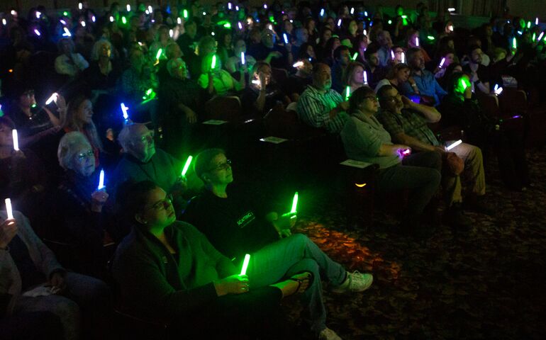 Film viewers holding glow sticks at this year's Camden Film Festival.