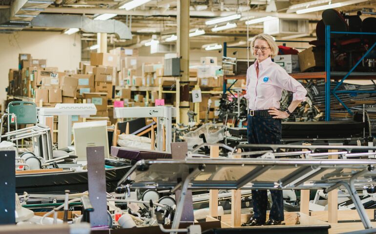 Elizabeth McLellan, founder of Partners for World Health, in the company's warehouse.
