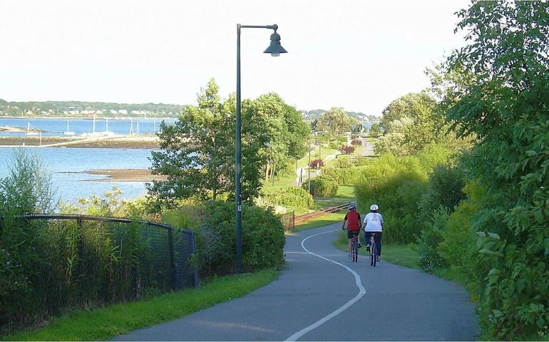 trailway in portland with two cyclists