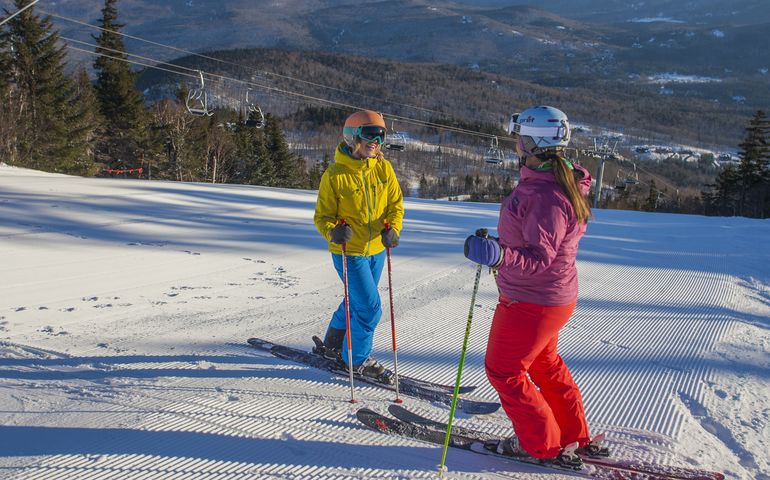 two skiers on Sunday River slope