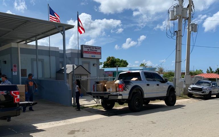 pickup truck being unloaded at health center in Puerto Rico