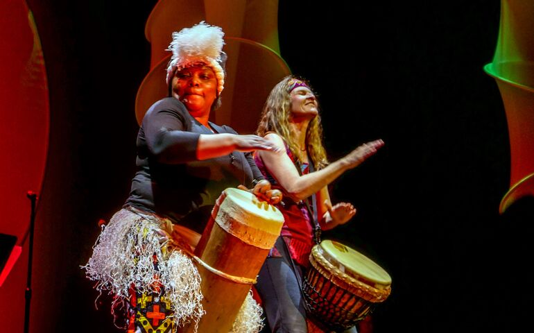 Two female drummers on stage at Merrill Auditorium in Portland earlier this year.