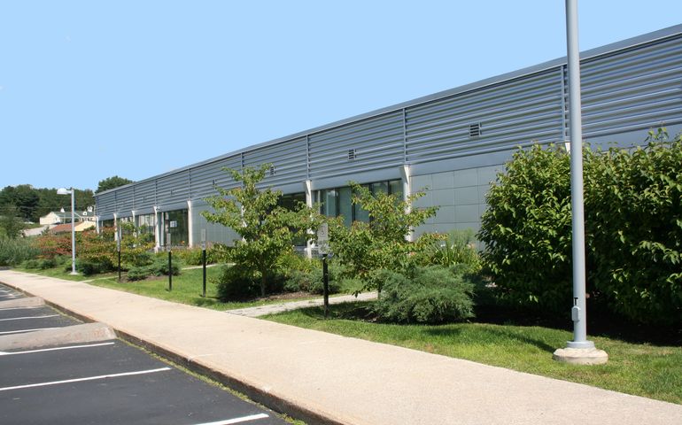 entrance to one-story manufacturing plant