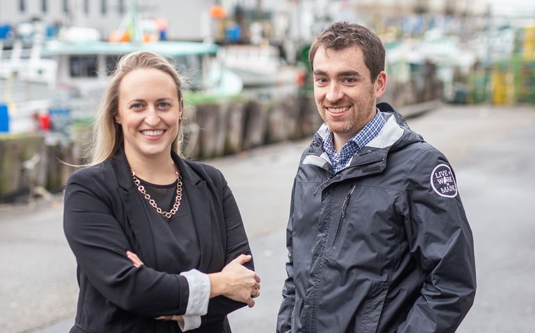 Photo of Katie Shorey and Nate Wildes standing outside on the Portland waterfront 