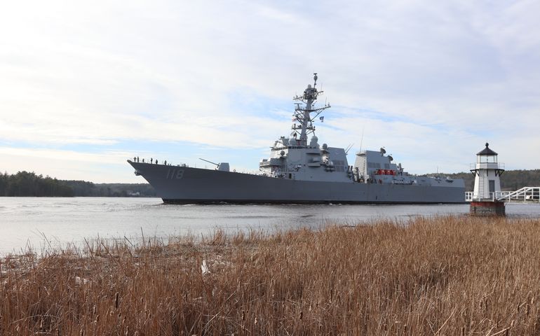 photo of destroyer ship on water 