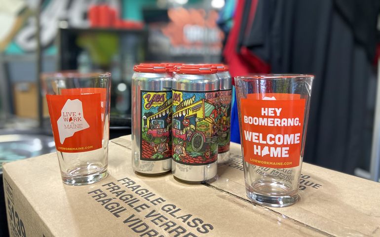 two beer glasses and a six-pack of beer