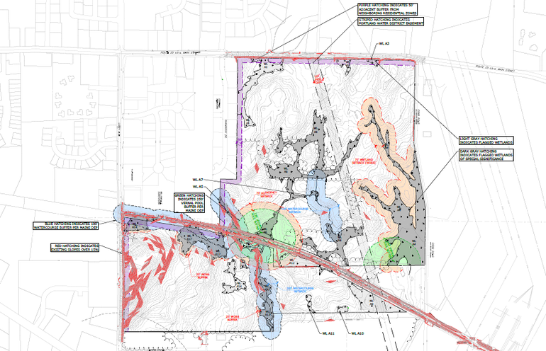 a conceptual map of development of an industrial park, a fat-L-shaped plot with several roads going through it