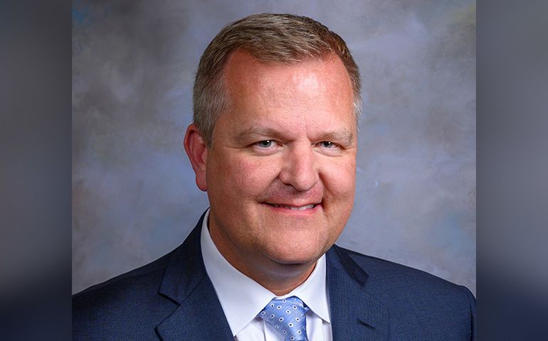 portrait of middle-aged man in a tie and jacket