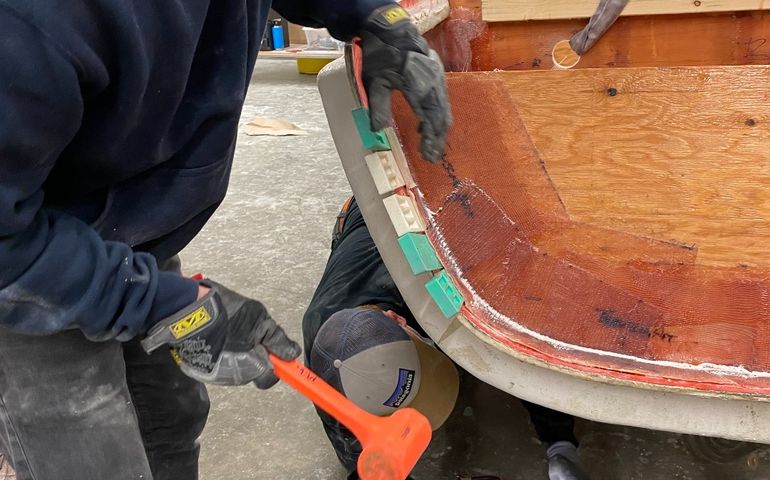 Students working on a boat 