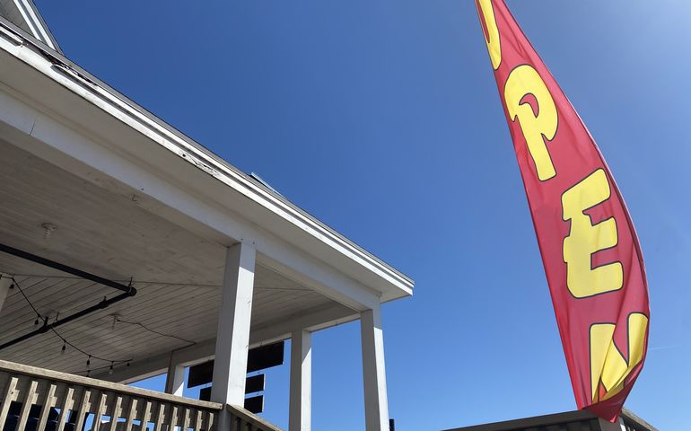 Open sign in front of a store in Scarborough 