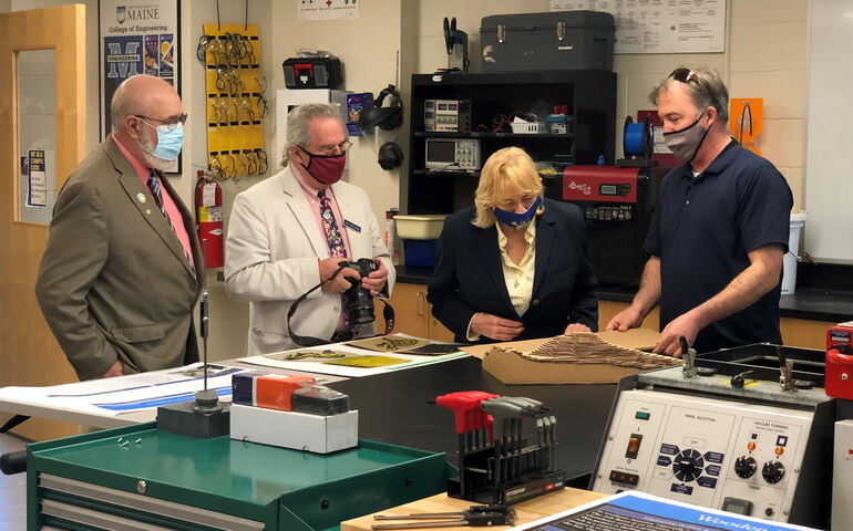 Janet Mills with three other people at Foster CTE 