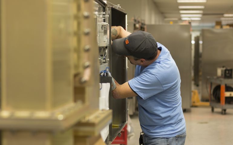 photo of someone in a microwave factory 