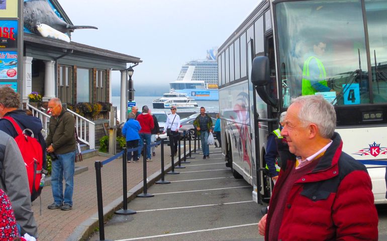 people and bus at wharf