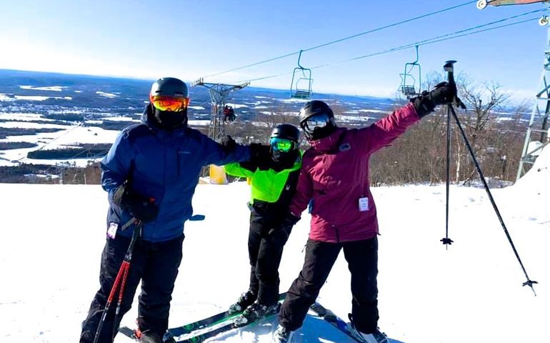 3 people on skis