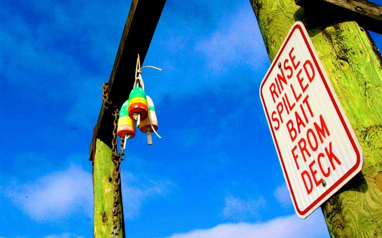 sign and pilings