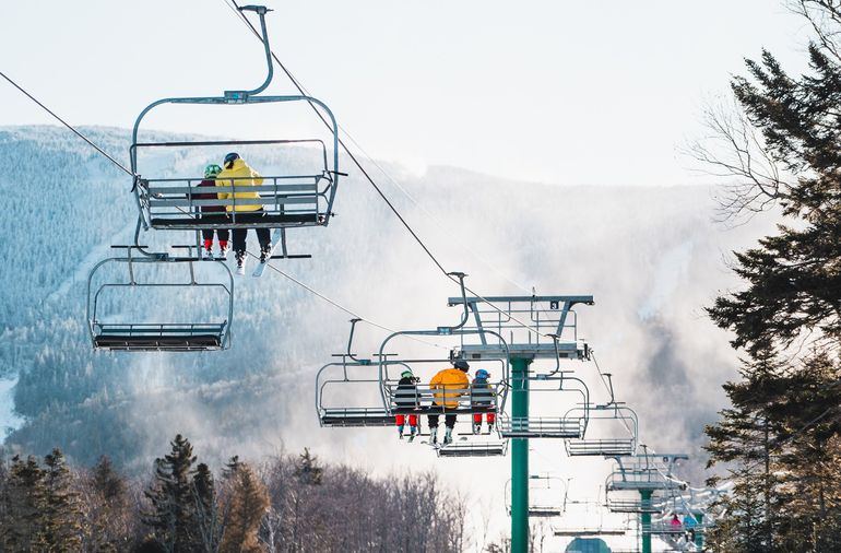 skiers on a chairlift