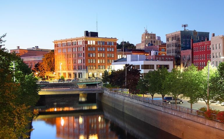 Part of the city of Bangor includes buildings and a tree-lined canal.