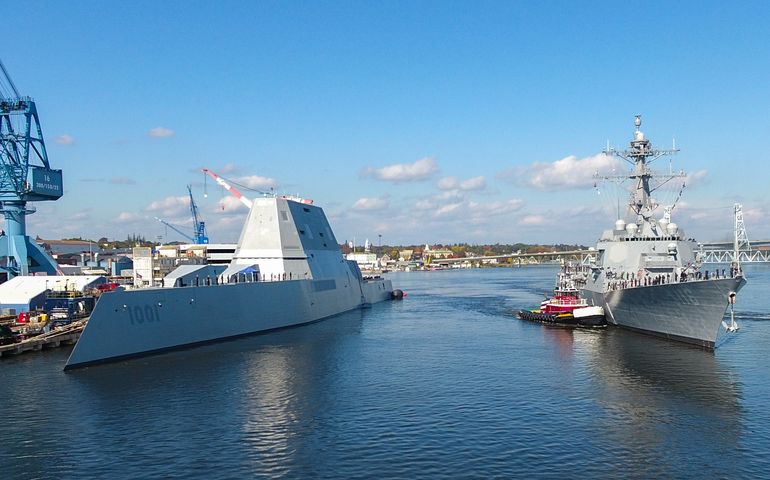 two Navy destroyers near dock