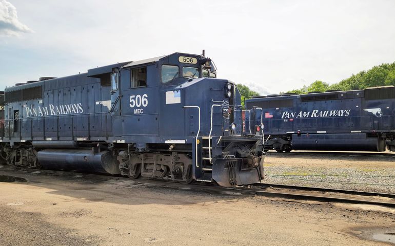 two railroad engines with "Pan Am" logos