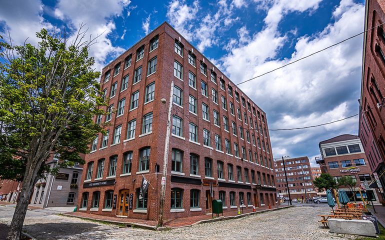 brick building and cobblestone street