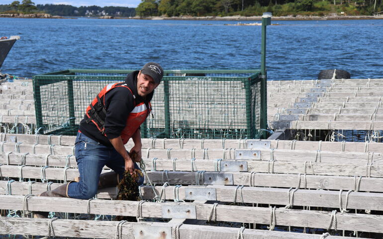 person on raft pulling rope