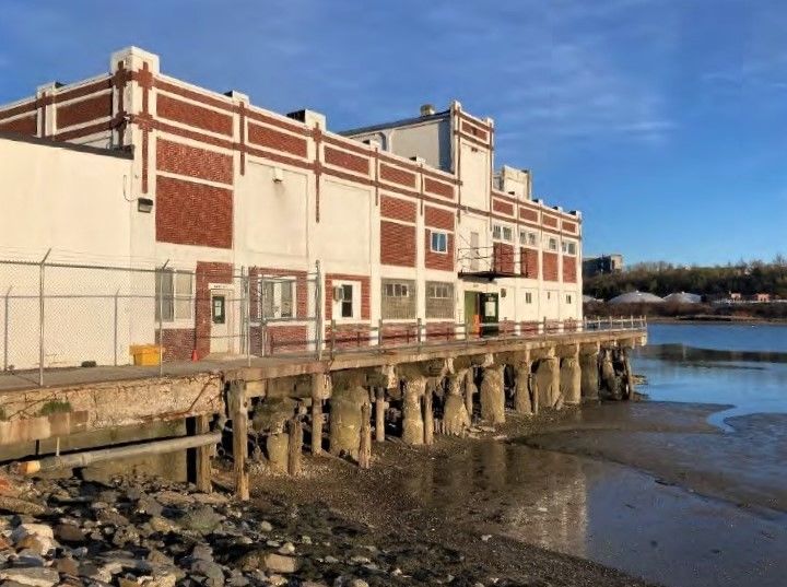 closeup of building on wharf at low tide