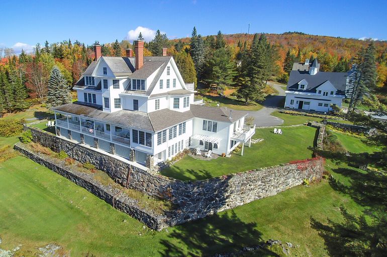 aerial of house, barn and stone wall