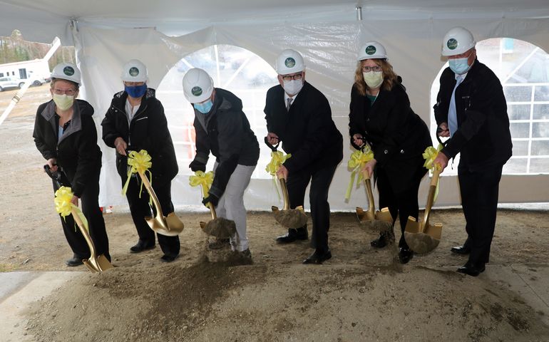 6 people with shovels and ribbons