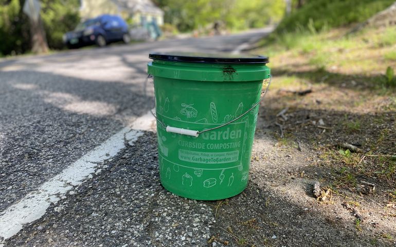 Green Garbage to Garden bucket ready for curbside pickup