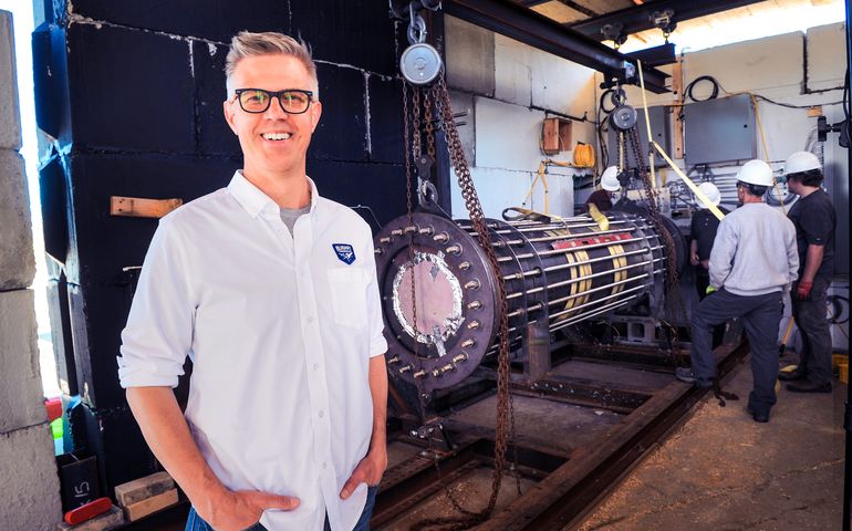 person smiling with machinery