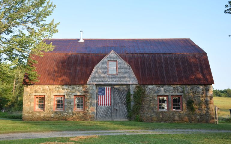 stone barn flag red roof