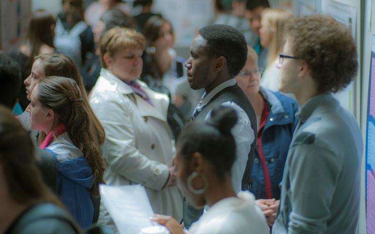 Husson diverse students milling about 