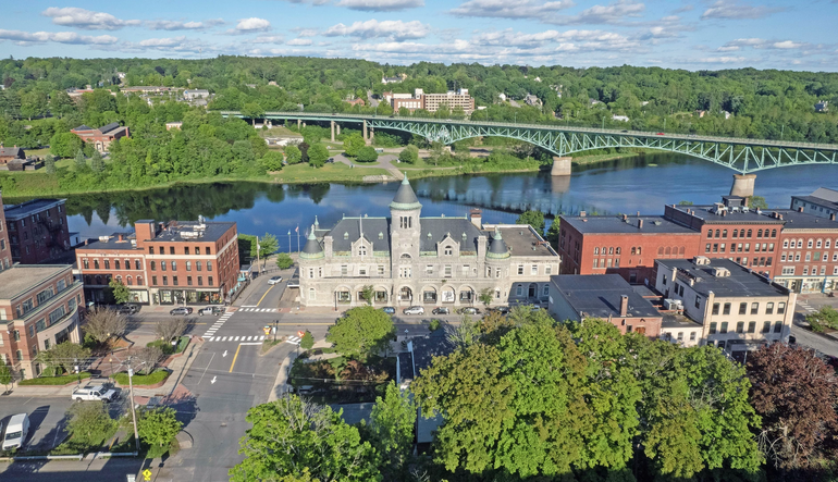 aerial of old buildings and river