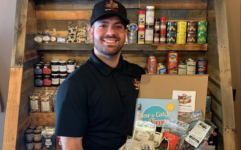 smiling person with food in box