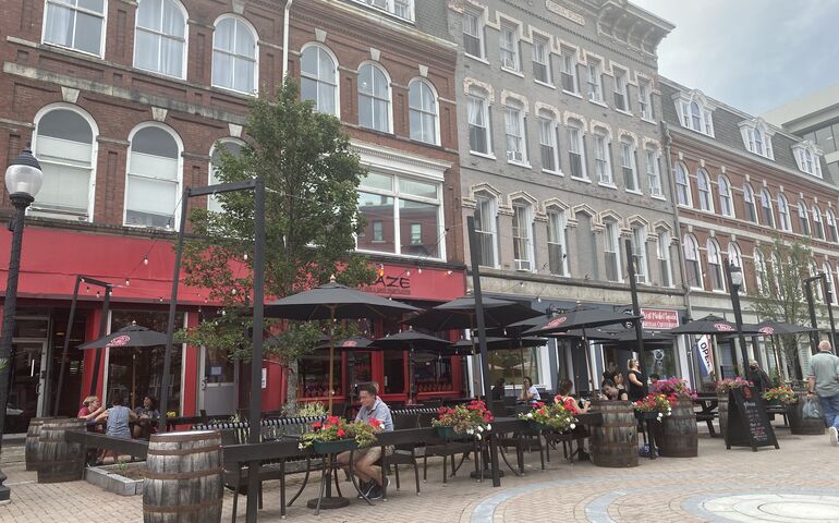 People dining outside in Bangor on a summer day 