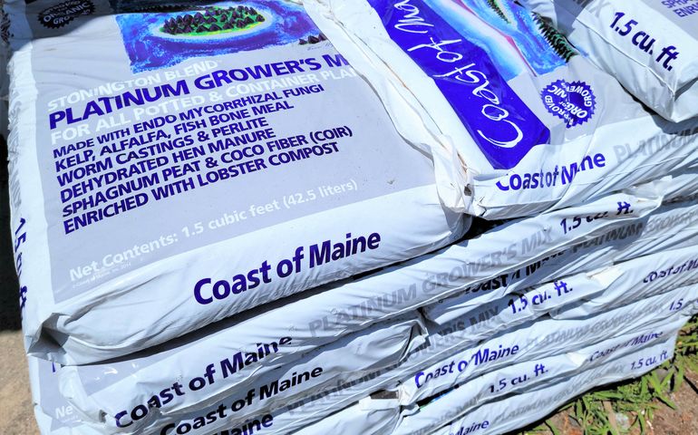 bags of potting soil on a pallet