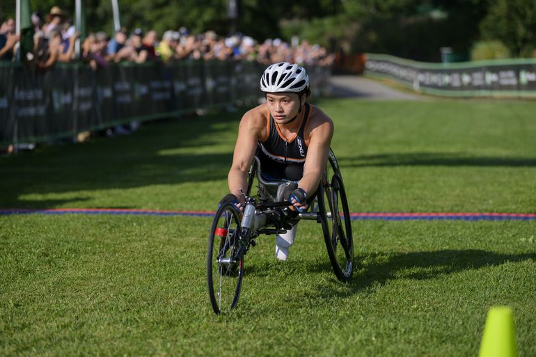 Wheelchair athlete crosses finish line 