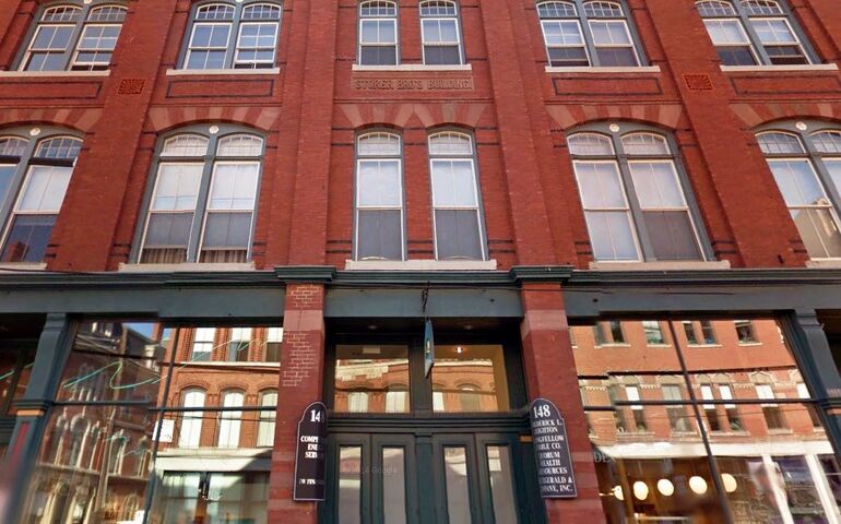 brick building with reflective windows